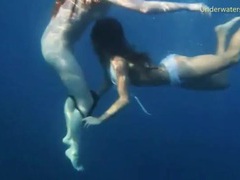 VidsPlus presents: Bikini girls swim in the ocean and strip