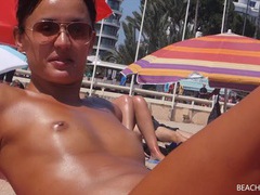 VidsPlus presents: Small tits girl with a great tan is topless at the beach