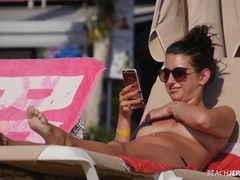 VidsPlus presents: Topless amateur relaxes on a lounge chair